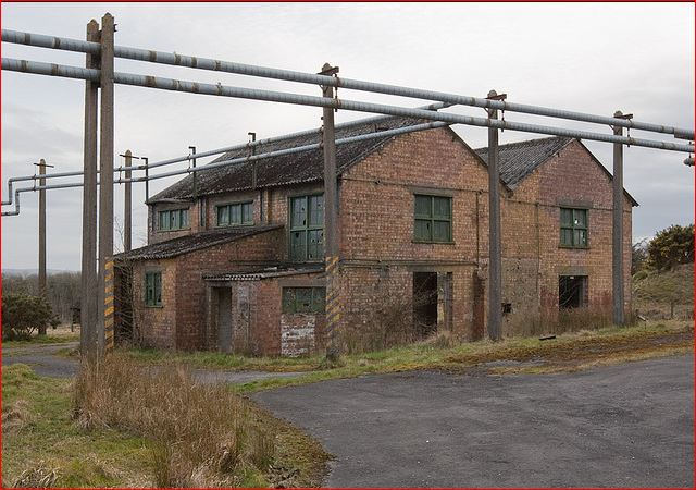 Broughton Moor WW2 munitions building exterior with pipes